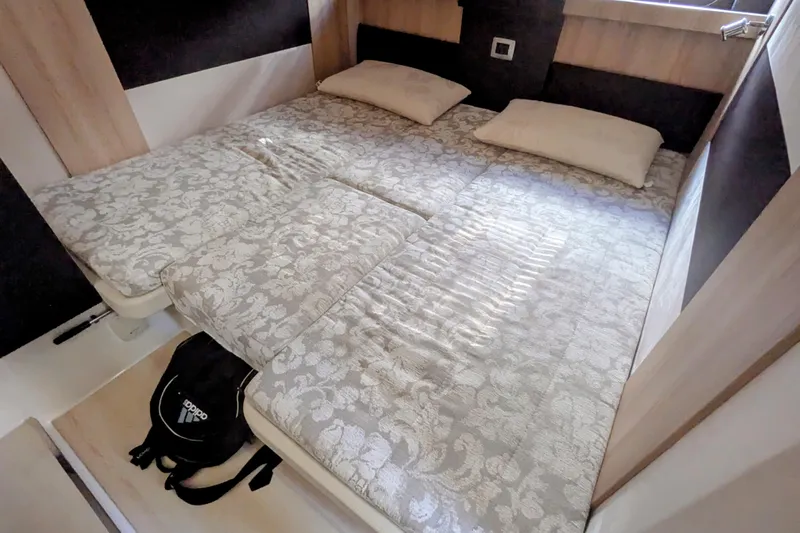  Yacht Photos Pics Interior cabin of 2016 Cranchi M 44 HT yacht with double bed and pillows.