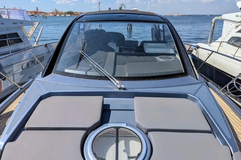  Yacht Photos Pics 2016 Cranchi M 44 HT yacht docked, showcasing sleek design and spacious deck.