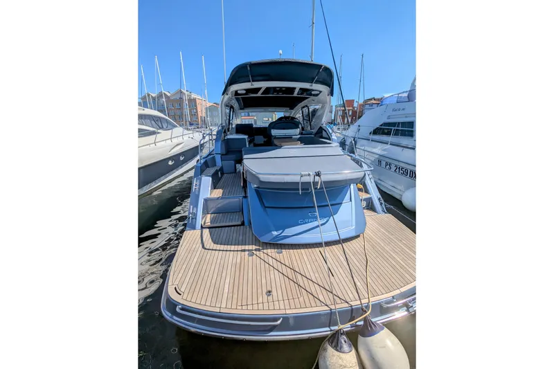  Yacht Photos Pics 2016 Cranchi M 44 HT yacht docked at marina, showcasing sleek design and spacious deck.