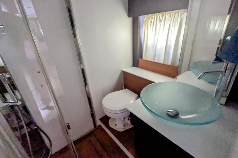  Yacht Photos Pics Bathroom interior of 2016 Cranchi M 44 HT yacht with modern fixtures.
