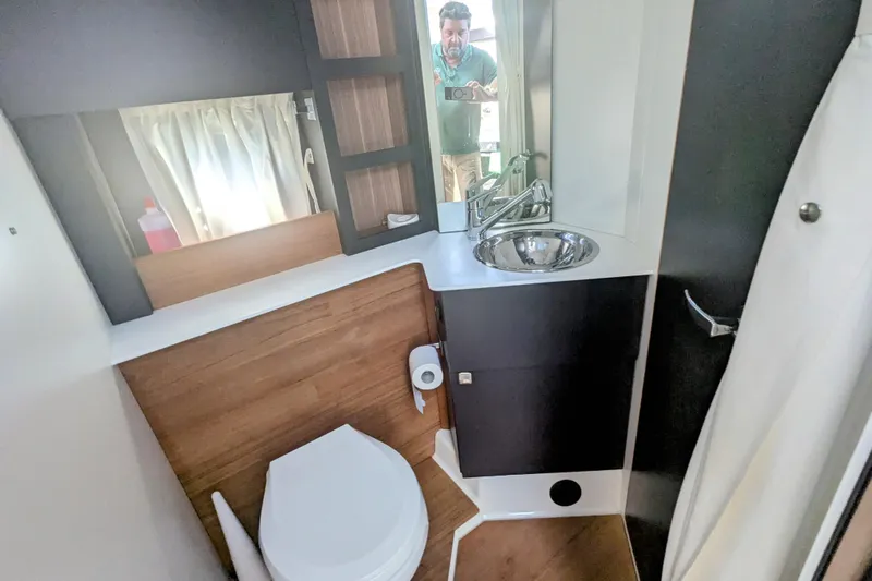  Yacht Photos Pics Bathroom interior of 2016 Cranchi M 44 HT yacht with sink and toilet.