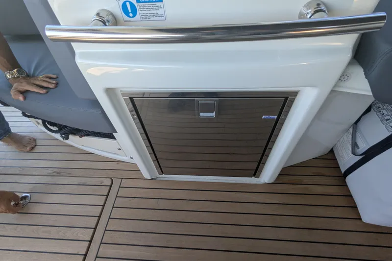  Yacht Photos Pics 2016 Cranchi M 44 HT yacht interior with stainless steel fridge and teak flooring.