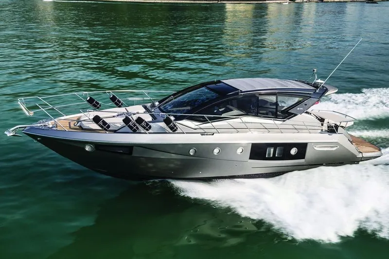  Yacht Photos Pics 2016 Cranchi M 44 HT yacht cruising on clear blue water.