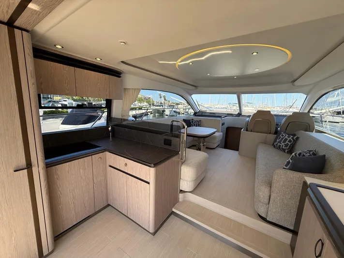  Yacht Photos Pics Luxurious interior of 2025 Azimut Fly 53 yacht with modern kitchen and seating area.