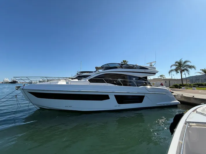  Yacht Photos Pics 2025 Azimut Fly 53 yacht docked in a sunny marina setting.