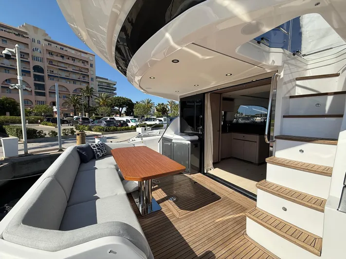  Yacht Photos Pics Luxurious 2025 Azimut Fly 53 yacht with elegant outdoor seating and modern interior.