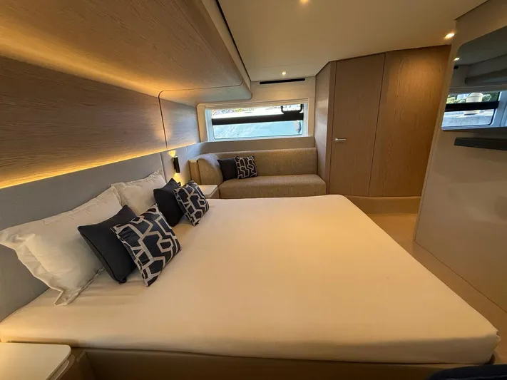  Yacht Photos Pics Luxurious bedroom interior of 2025 Azimut Fly 53 yacht with modern design and cozy bedding.