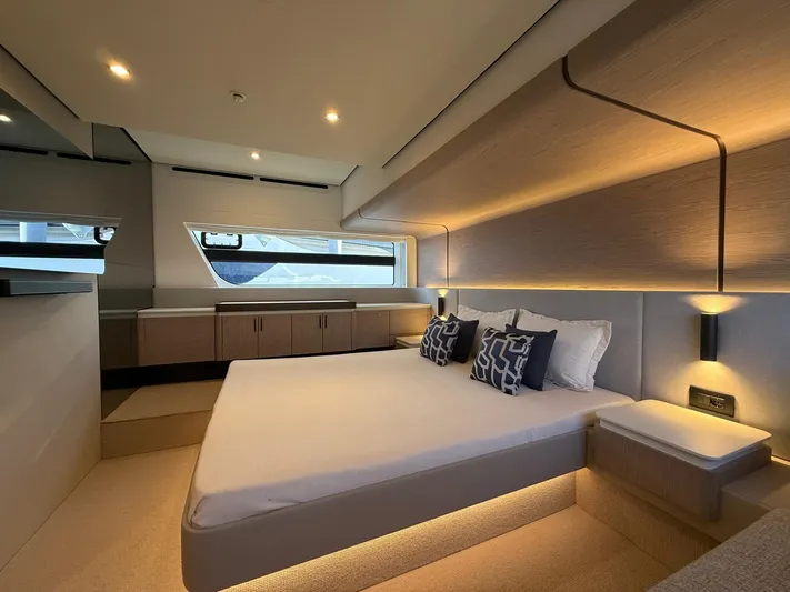  Yacht Photos Pics Luxurious bedroom interior of 2025 Azimut Fly 53 yacht with modern design and ambient lighting.
