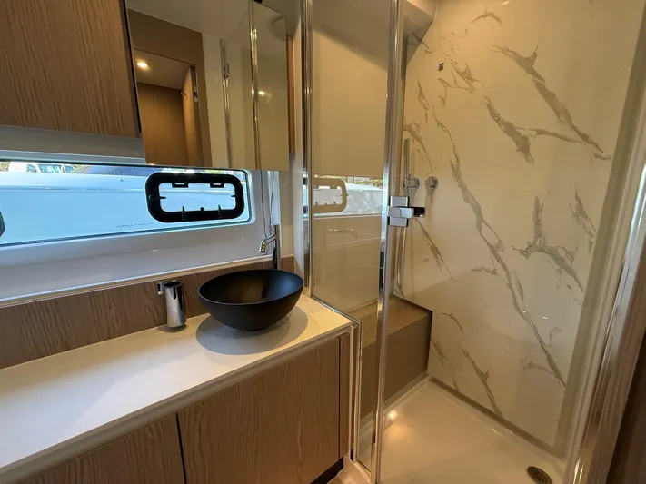  Yacht Photos Pics Luxurious bathroom in 2025 Azimut Fly 53 yacht with modern fixtures and elegant design.