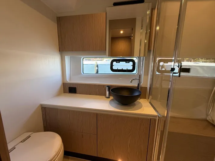  Yacht Photos Pics Modern bathroom interior of 2025 Azimut Fly 53 yacht with sleek design and elegant fixtures.