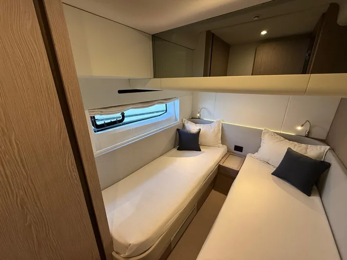  Yacht Photos Pics 2025 Azimut Fly 53 yacht cabin with twin beds and modern interior design.