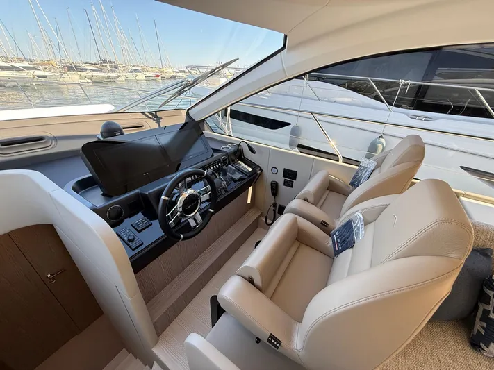  Yacht Photos Pics Interior of 2025 Azimut Fly 53 yacht with modern helm and luxurious seating.