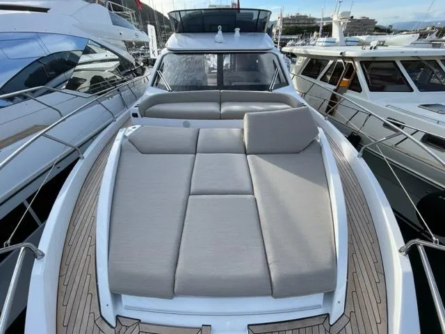  Yacht Photos Pics 2023 Azimut Fly 53 yacht with spacious sunbathing deck, docked at marina.