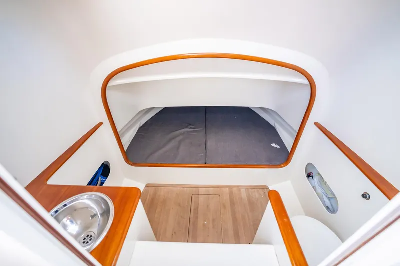 Reese Lee Yacht Photos Pics Interior cabin of 2003 Gamefisherman 34 Express boat with wood accents and compact design.