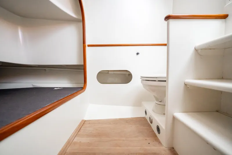 Reese Lee Yacht Photos Pics Interior of 2003 Gamefisherman 34 Express boat, featuring a compact bathroom area.