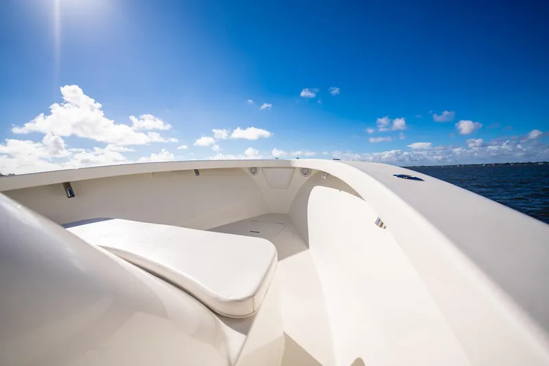 Reese Lee Yacht Photos Pics 2003 Gamefisherman 34 Express boat deck under clear blue sky.