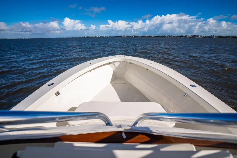 Reese Lee Yacht Photos Pics 2003 Gamefisherman 34 Express boat on open water under clear blue sky.
