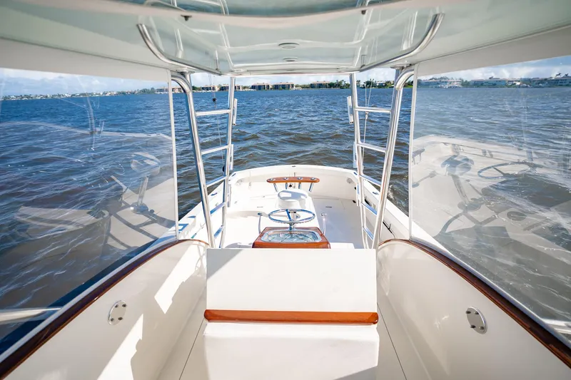 Reese Lee Yacht Photos Pics 2003 Gamefisherman 34 Express boat interior with ocean view, featuring sleek design and seating.