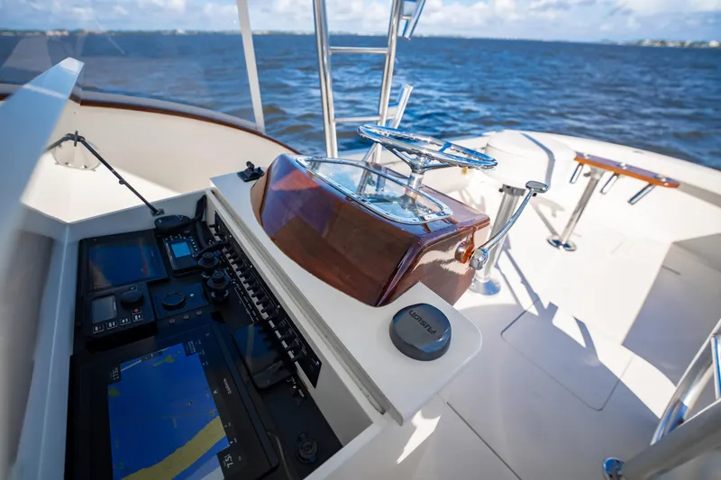 Reese Lee Yacht Photos Pics 2003 Gamefisherman 34 Express boat helm with navigation equipment and ocean view.