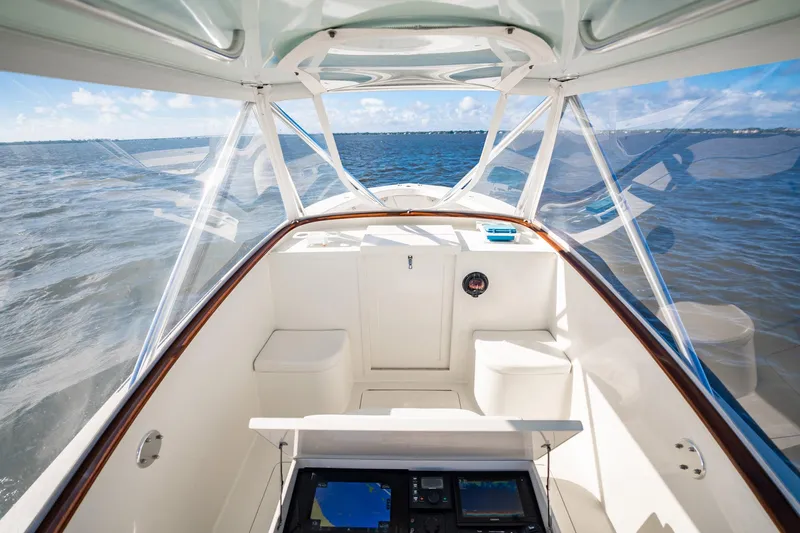Reese Lee Yacht Photos Pics 2003 Gamefisherman 34 Express boat interior with ocean view, featuring navigation equipment.