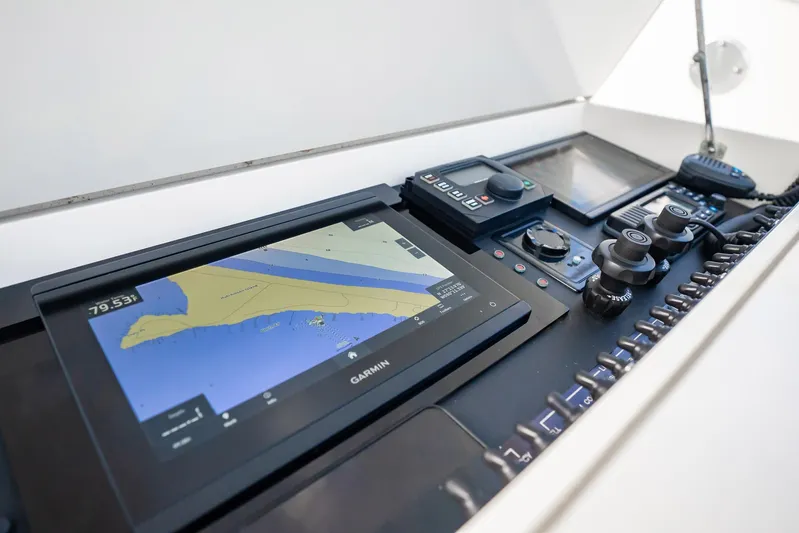 Reese Lee Yacht Photos Pics 2003 Gamefisherman 34 Express boat dashboard with Garmin navigation system and controls.