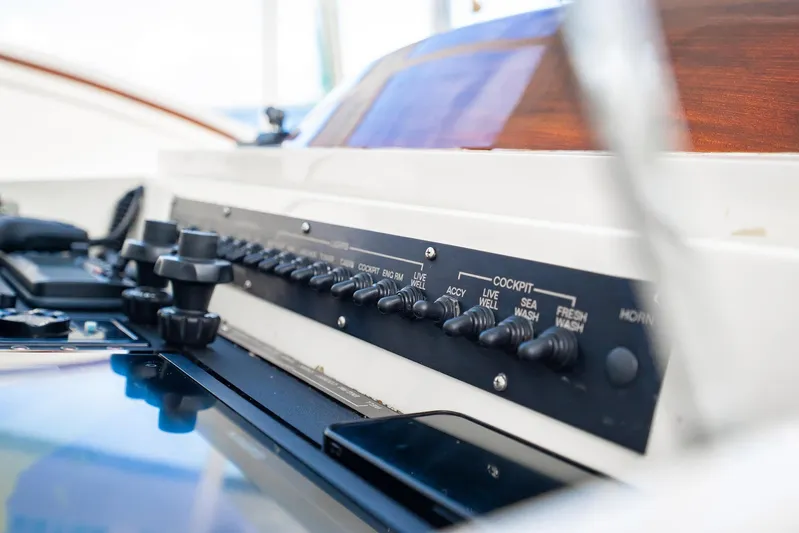 Reese Lee Yacht Photos Pics Control panel of a 2003 Gamefisherman 34 Express boat, featuring various switches.