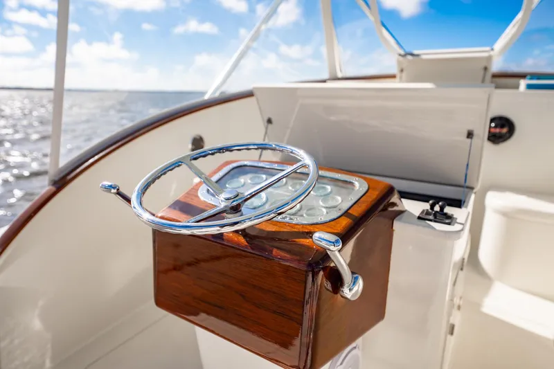 Reese Lee Yacht Photos Pics Steering wheel of 2003 Gamefisherman 34 Express boat with ocean view.