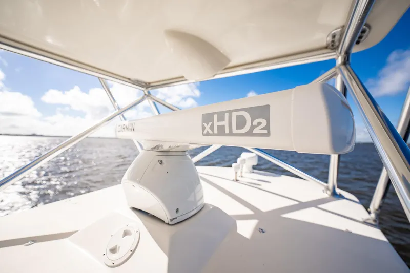 Reese Lee Yacht Photos Pics Radar equipment on 2003 Gamefisherman 34 Express boat under clear blue sky.