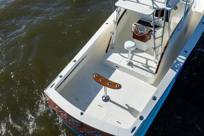 Reese Lee Yacht Photos Pics 2003 Gamefisherman 34 Express boat, featuring a spacious deck and helm station.