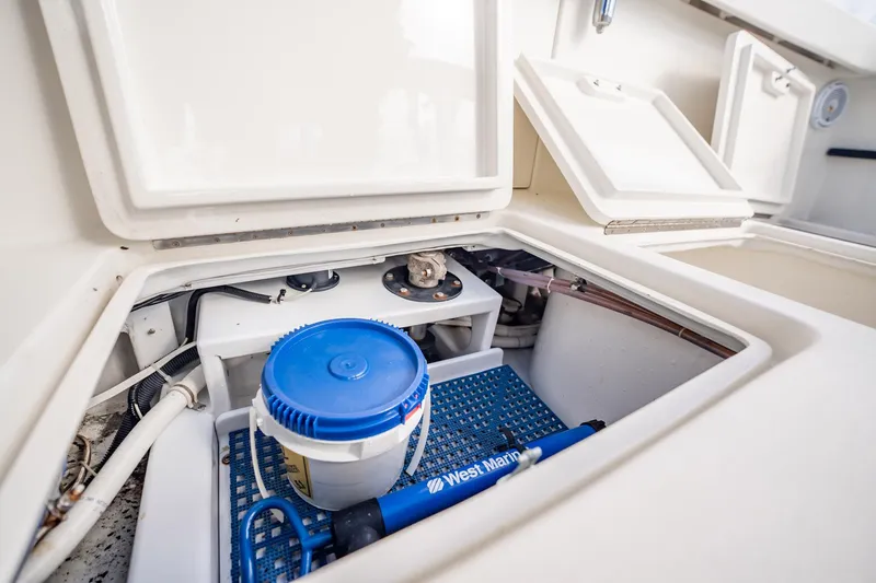 Reese Lee Yacht Photos Pics Storage compartment on 2003 Gamefisherman 34 Express boat with marine equipment.