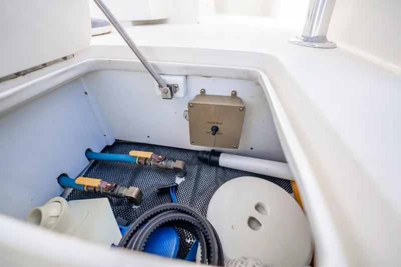 Reese Lee Yacht Photos Pics Storage compartment of 2003 Gamefisherman 34 Express boat with various equipment and tools.
