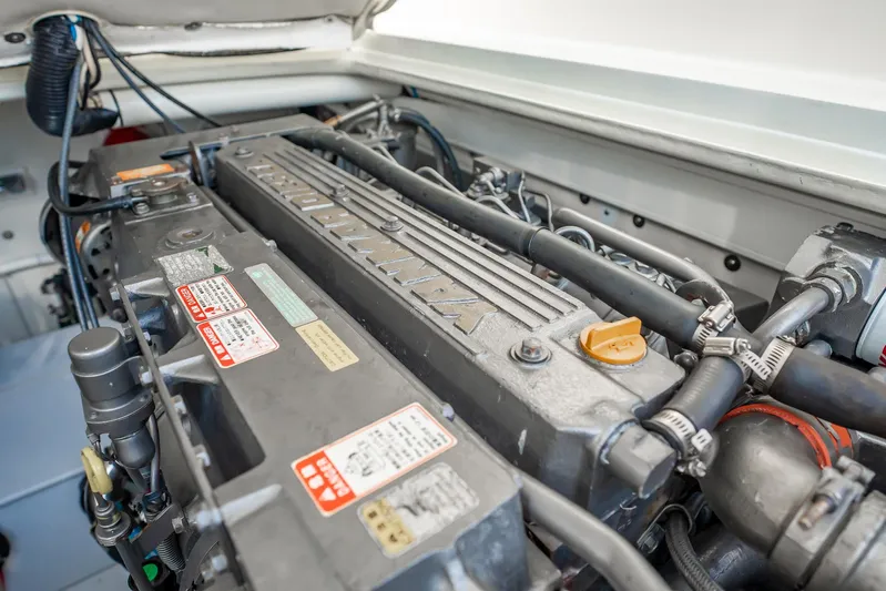 Reese Lee Yacht Photos Pics Engine compartment of a 2003 Gamefisherman 34 Express boat, showcasing detailed machinery.