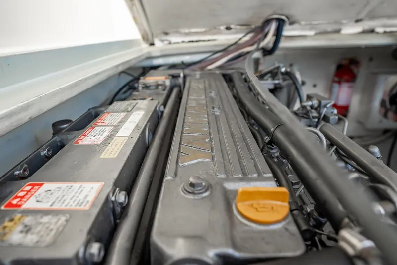 Reese Lee Yacht Photos Pics Engine compartment of 2003 Gamefisherman 34 Express boat, featuring Yanmar engine components.