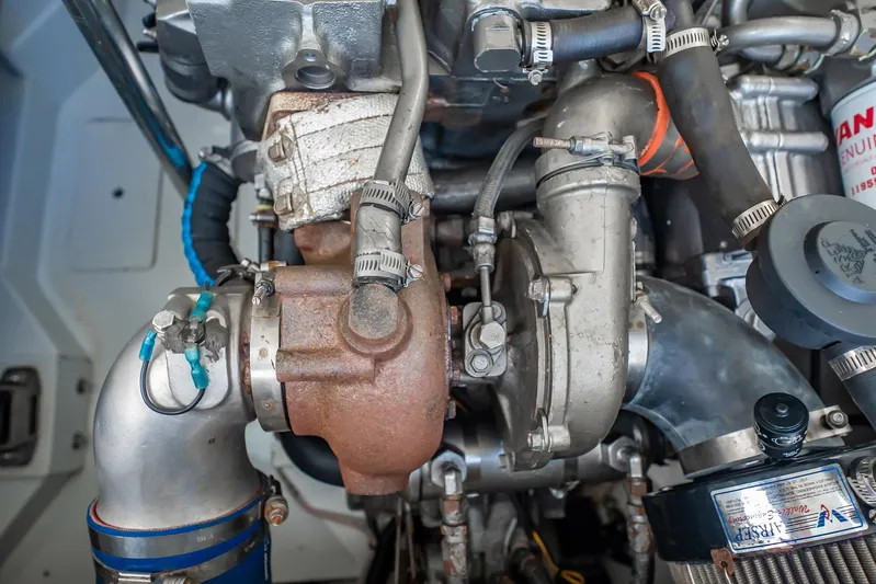 Reese Lee Yacht Photos Pics Engine components of a 2003 Gamefisherman 34 Express boat, showcasing detailed mechanical parts.