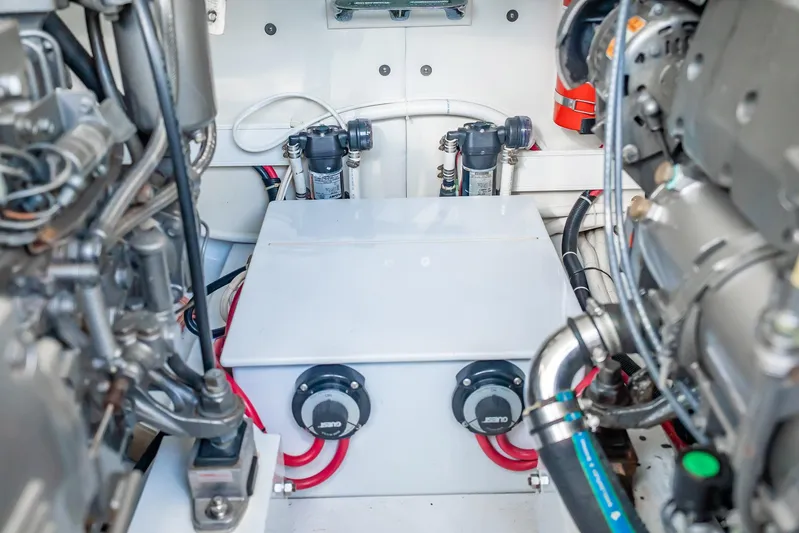 Reese Lee Yacht Photos Pics Engine room of 2003 Gamefisherman 34 Express boat, showcasing mechanical components and wiring.