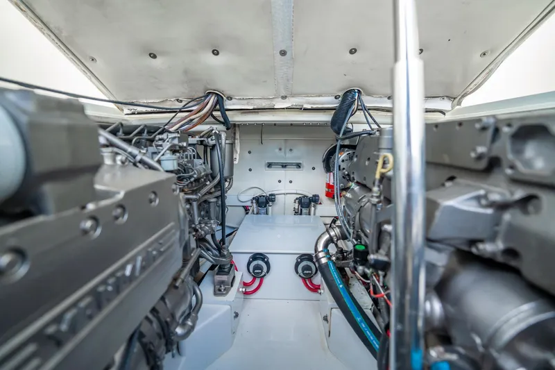 Reese Lee Yacht Photos Pics Engine room of 2003 Gamefisherman 34 Express boat, showcasing dual engines and mechanical components.