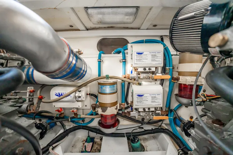 Reese Lee Yacht Photos Pics Engine room of 2003 Gamefisherman 34 Express with fuel priming system and piping.