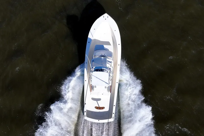 Reese Lee Yacht Photos Pics Aerial view of 2003 Gamefisherman 34 Express boat cruising on water.