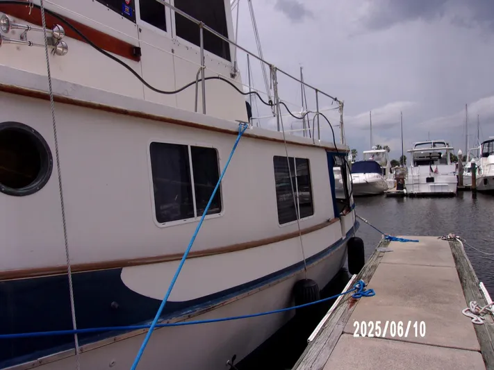 Chesapeake Yacht Photos Pics 1986 Kadey-Krogen Manatee 36 docked at marina, side view.