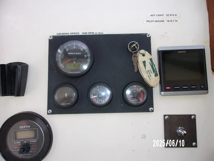 Chesapeake Yacht Photos Pics Control panel of a 1986 Kadey-Krogen Manatee 36 boat with gauges and keys.