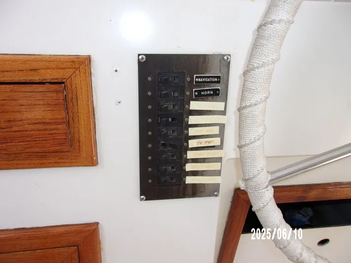 Chesapeake Yacht Photos Pics Control panel on 1986 Kadey-Krogen Manatee 36 boat with switches and labels.