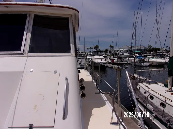Chesapeake Yacht Photos Pics 1986 Kadey-Krogen Manatee 36 docked at a marina, surrounded by other boats.