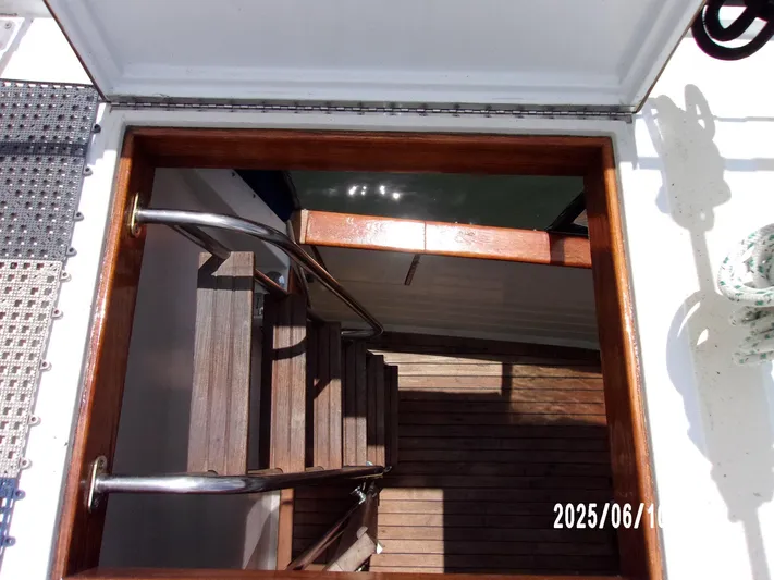 Chesapeake Yacht Photos Pics Hatch opening with wooden stairs on a 1986 Kadey-Krogen Manatee 36 boat.