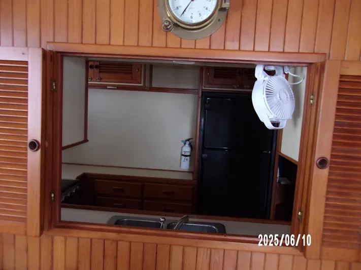 Chesapeake Yacht Photos Pics 1986 Kadey-Krogen Manatee 36 interior kitchen with wooden cabinets and appliances.