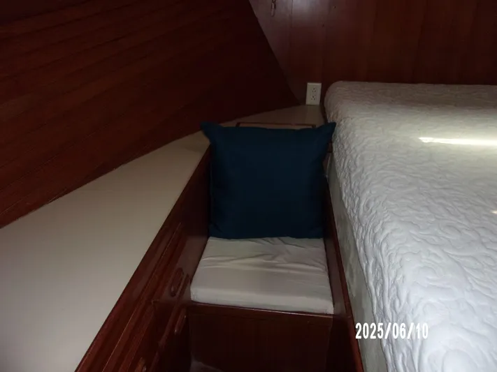 Chesapeake Yacht Photos Pics Cozy cabin interior of 1986 Kadey-Krogen Manatee 36 with wooden paneling and cushioned seating.