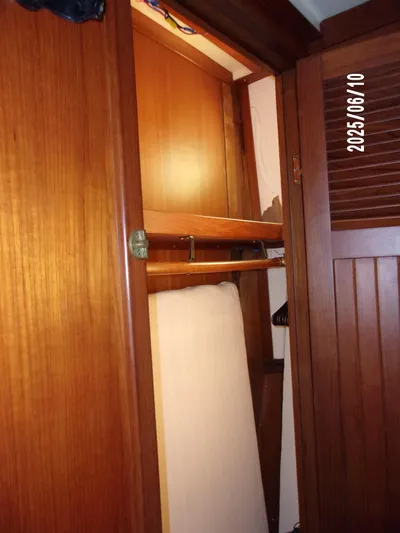 Chesapeake Yacht Photos Pics Wooden closet interior on 1986 Kadey-Krogen Manatee 36 boat.
