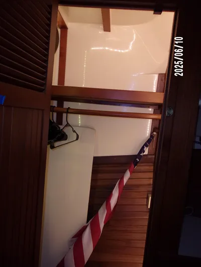 Chesapeake Yacht Photos Pics 1986 Kadey-Krogen Manatee 36 interior with wooden paneling and American flag.