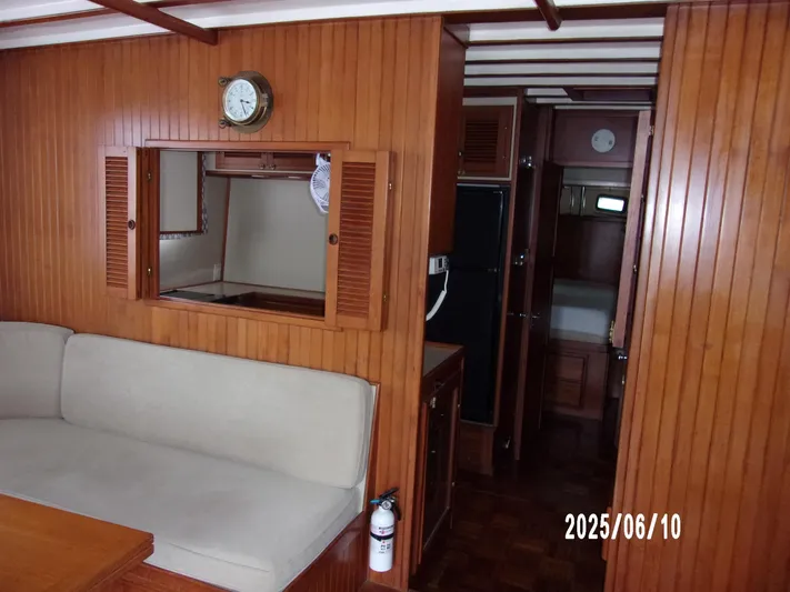 Chesapeake Yacht Photos Pics 1986 Kadey-Krogen Manatee 36 interior with wood paneling and beige seating.